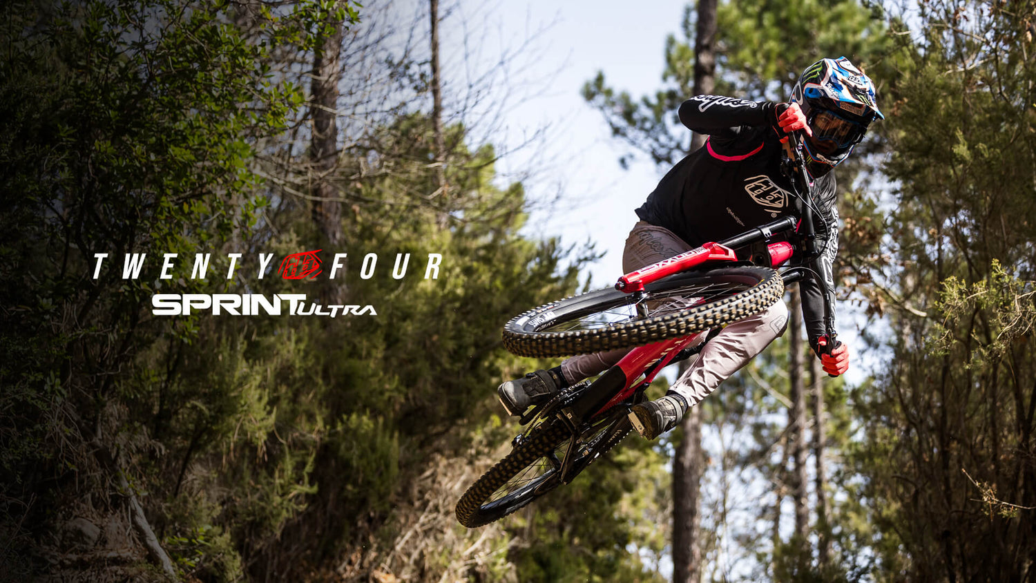 Troy Lee Designs New Downhill Collection - rider going ove a jump